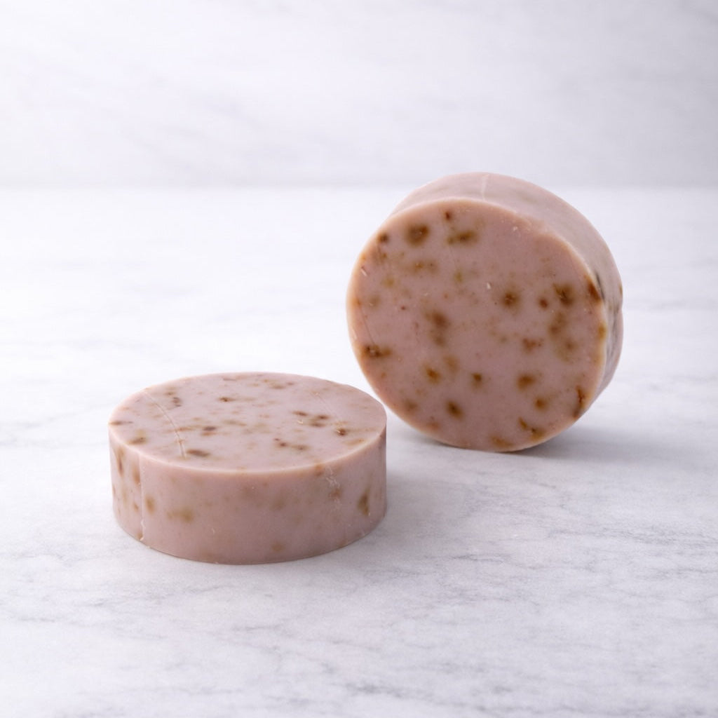 Two round bars of lavender and goat milk soap
