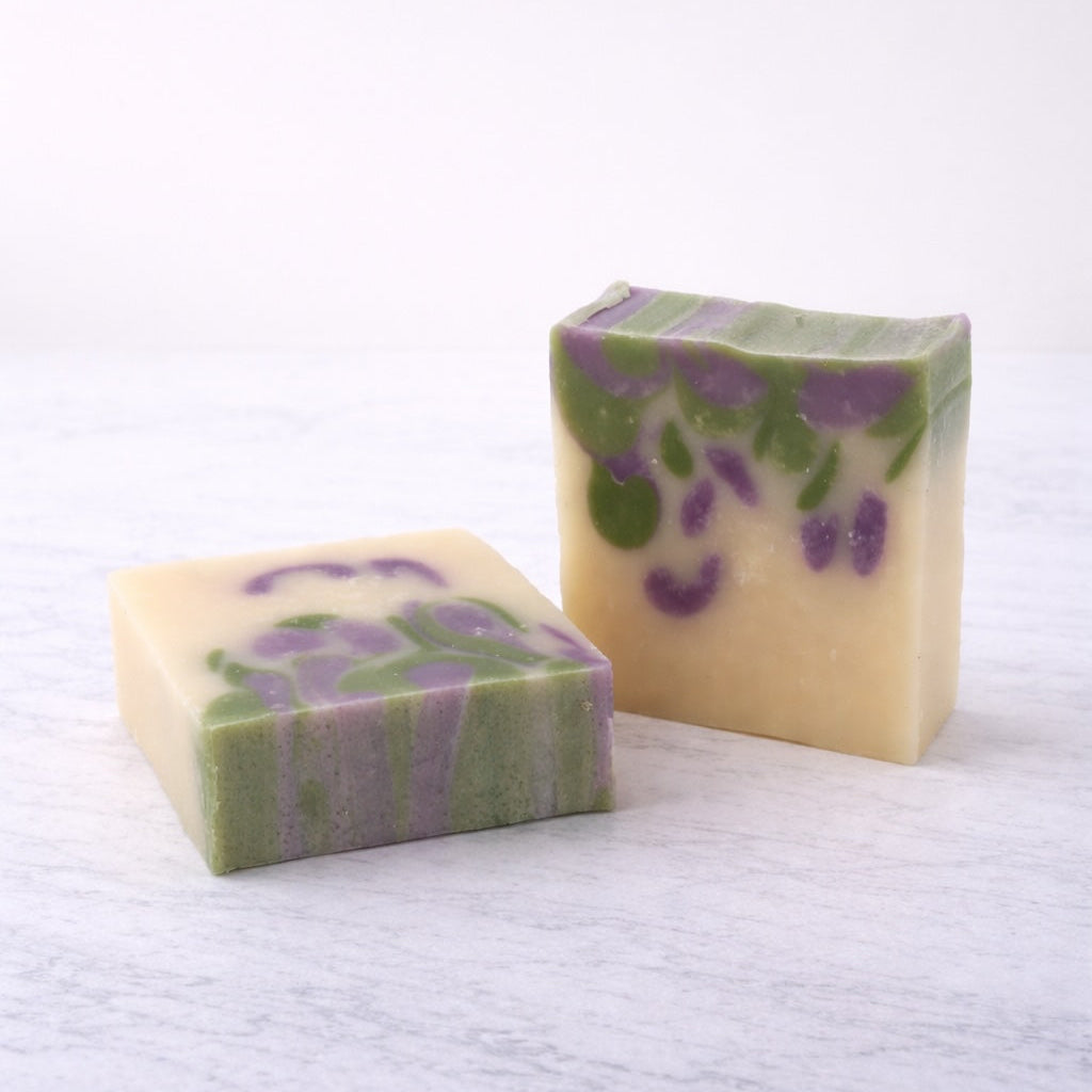 Two bars of soap with floral design on a white background