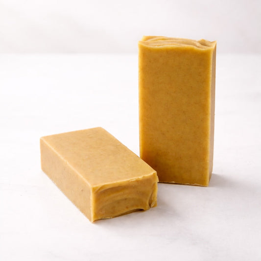 Two bars of turmeric and sandalwood soap